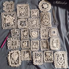 crocheted doily laid out on a black cloth with scissors and knitting needles