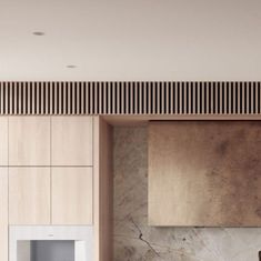 a modern kitchen with marble counter tops and wooden paneling on the walls, along with an oven