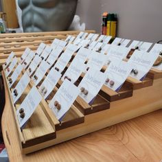 a wooden table topped with lots of cards