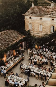 an aerial view of people sitting at tables outside