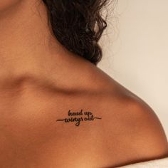 the back of a woman's shoulder with writing on it that reads, read up wrong out