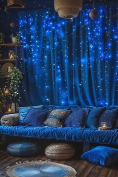 a living room filled with blue couches and pillows