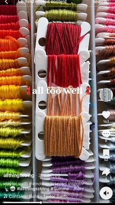 several rows of different colored threads and spools