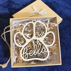 a box filled with gold and white ornaments