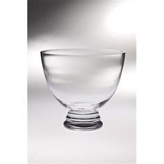 a glass bowl sitting on top of a table