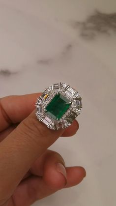 2.7ct natural emerald stone surounded by round brilliant and baguette cut natural diamonds set in 18kt white gold Beautiful Diamond Necklace, Jewellery Board, Emerald And Diamond Ring, Emerald Stone, Rings Wedding, Baguette Cut, Lovely Jewellery, Stunning Jewellery