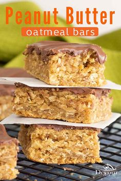 peanut butter oatmeal bars stacked on top of each other with chocolate frosting