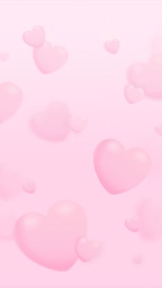 many pink hearts floating in the air