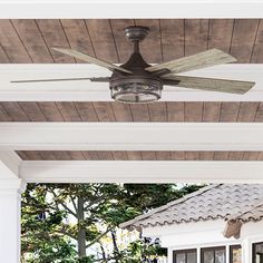 a ceiling fan on the outside of a house