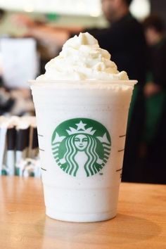 a starbucks drink with whipped cream on top