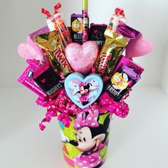 a cup filled with lots of candy and candies