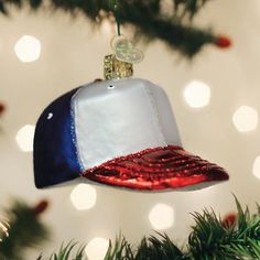 a baseball hat ornament hanging from a christmas tree