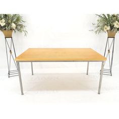 a table with two planters on each side