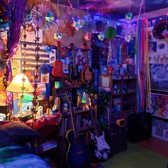 a room filled with lots of musical instruments and decorations hanging from the ceiling over a bed