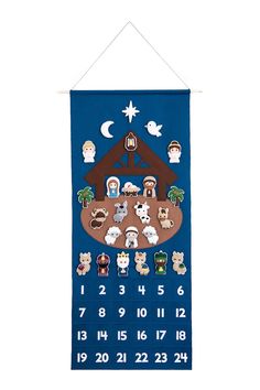 a cross stitch nativity chart hanging on a wall