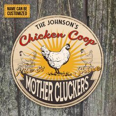 a chicken coop sign hanging on the side of a wooden fence