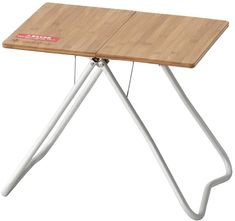 a wooden table with two metal legs and a white frame on the top, against a white background