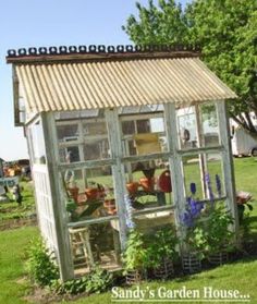 a garden house made out of an old window