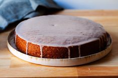 a cake sitting on top of a wooden cutting board