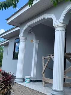 an outside view of a house with columns