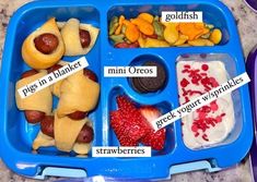 a blue tray filled with different types of food