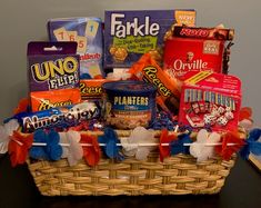 a basket filled with snacks and candy on top of a table