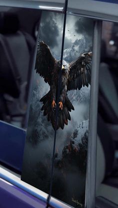 an eagle is shown on the side of a car with its wings spread out and it's eyes open