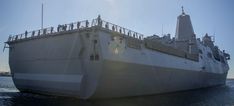 a large white ship floating on top of water