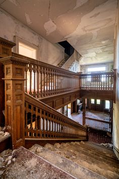 an old wooden staircase in the middle of a building