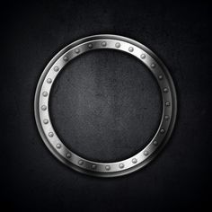 a metal ring with rivets on a black background stock photo - 1387982