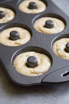 a muffin tin filled with cupcake batter