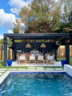 an outdoor dining area next to a swimming pool