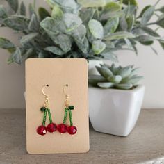 Handmade glass beaded cherry dangle earrings. Perfect for fruit enthusiasts and garden lovers alike, they add a playful touch to any outfit. Whether you're strolling through the farmer's market or attending a garden party, these trendy cherry accessories are sure to make a statement. I offer a variety of metal finishes of french hooks in case of sensitivity, but all of them are hypoallergenic and Nickle free! Check my FAQs for information on how to care for your metal jewelry.  French hook finishes available:  Gold plated brass  Silver plated brass  Rose gold plated stainless steel I use high quality glass, acrylic and natural stone beads for all of my items. My main goal is to create beautiful peices that are also affordable!  Every item is made to order, If you like the style but prefer Cherry Accessories, Beaded Cherry, Fruit Jewelry, Earrings Trendy, Handmade Glass Beads, Cute Fruit, Red Cherry, Earrings Cute, Farmer's Market