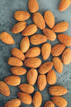 almonds on a gray surface