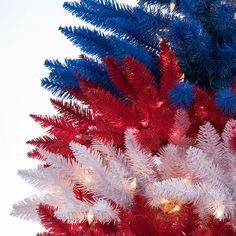 a red, white and blue christmas tree with lights