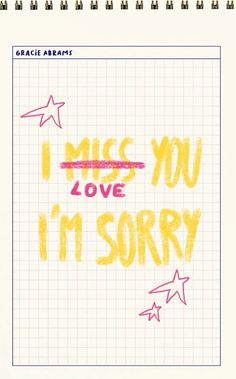 i miss you love it's sorry written in yellow and pink on lined paper