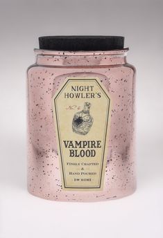 a candle that is pink with black speckles