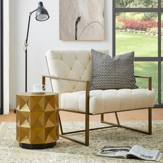 a living room scene with focus on the chair and coffee table in the foreground