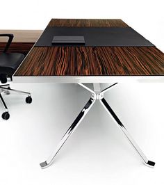 an office desk with two black chairs and a wooden table in front of it on wheels