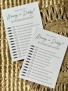 two wedding program cards sitting on top of a woven table cloth with black ink and calligraphy