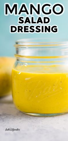 mango salad dressing in a mason jar with the words mango salad dressing written on it