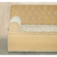 an old fashioned couch is upholstered and ready to be used as a bed