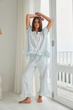 Description Ruffles galore, our Sophie Pajama Set brings effortless glamour to your downtime. Unwind and recharge in style. Relaxed style fit Button down top, maternity friendly Cropped length pants with a comfortable elastic & drawstring & pockets 100% Cotton, pre-washed and softened Sizing Ruby is wearing size S, and is an Australian size 6-8, US size 2-4, approx 5'7 tall. Neve is wearing size S, and is an Australian size 8-10, US 4-6, approx 5'8 tall. Relaxed style fit. The following guidelin Resort Wear Men, Gathered Sleeves, Sleep Set, Cotton Set, Pyjama Set, Bridal Shop, Stretch Pants, Relaxed Style, Cotton Bag