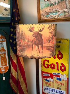 a lamp that is sitting on top of a table next to flags and other items