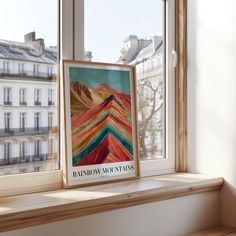 a window sill with a framed poster on it