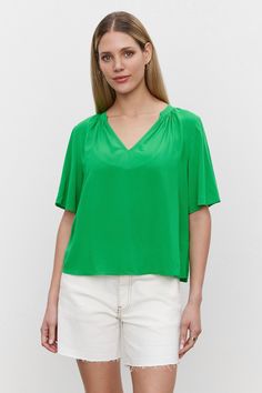 The model is wearing a Velvet by Graham & Spencer JAYCEE SPLIT NECK BLOUSE in woven challis fabric. Blouse Size Chart, Velvet Tees, Right To Privacy, Easy Breezy, Beautiful Gowns, The Body, Flutter Sleeve, Top Tee, Womens Tees