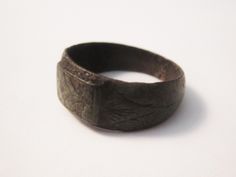 Here is a real treasure, an authentic late Medieval period bronze signet ring size 5 with floral or chevron on the bezel, found in Northern Europe.  This piece of history is very stable and can be worn with normal care.  It is dated between 1400 - 1600 AD.  With wear this will show the beautiful rich bronze alloy and shine like gold, but the patina now is outstanding.  It is size 5, and in complete and stable wearable condition.  This style ring has been popular since at least Roman times.  I am offering this ring with a Certificate of Authenticity and lifetime money back guarantee of authenticity. Medieval Period, Bronze Ring, Northern Europe, Christmas Deals, Signet Ring, Patina, Ring Size, Accessory Gift, Electronic Accessories