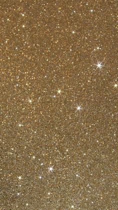 an image of some gold glitter with stars in the sky on this night time background