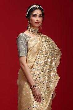 Golden saree highlighted with geometric mirror motif embroidery. Comes with blouse.
Component: 2
Embroidered
Sleeve Length: Short Sleeves
Fabric: Tissue
Color: Gold
 - Aza Fashions Golden Saree, Geometric Mirror, Motif Embroidery, Embroidered Saree, Gold Blouse, Blouse For Women, Fashion App, Buy Gold, Saree With Blouse