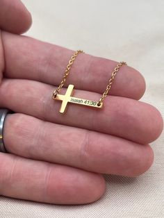 Our new personalized bible verse cross necklace for women.  A stunning and meaningful piece of jewelry designed to empower and inspire women in their faith journey!  This necklace combines contemporary style with timeless scripture, creating a powerful symbol of devotion and strength.  We take a double-mirrored finish cross pendant & professionally engrave your favorite bible verse, name, date, etc.   100% surgical stainless steel - no tarnishing or fading! * cross pendant is 25x14mm. <> 1. CUST Inspirational Gold Cross Jewelry, Minimalist Personalized Cross Pendant Necklace, Personalized Cross Jewelry For Everyday Wear, Personalized Everyday Cross Jewelry, Personalized Crucifix Cross Necklace, Inspirational Gold Cross Necklace, Bible Jewelry, Cross Necklace For Women, Bible Verse Necklace